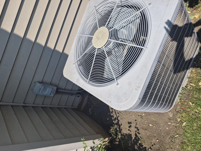Responded to no cooling call on residential air conditioning system. Upon inspection, determined compressor was not operating. Completed compressor will not cycle diagnosis and identified failed compressor as root cause. Unit's evaporator coil showed moderate dust and debris accumulation. Outdoor condenser unit located on concrete pad adjacent to building with visible soil disturbance near installation area. System requires compressor replacement to restore cooling operation.
