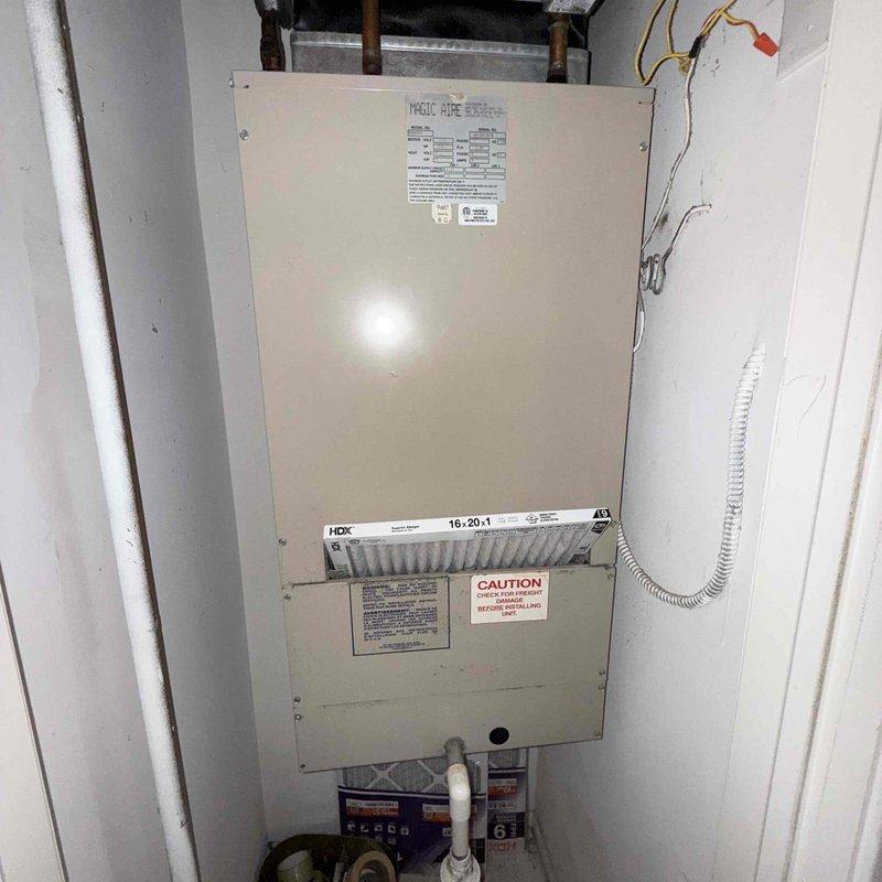 Completed routine air conditioner tune-up on approximately 20-year-old Magic Aire system. Performed comprehensive diagnostic testing using electrical meter to verify system performance, checked refrigerant levels, inspected filter condition, and confirmed all components operating within normal parameters. System running properly with no issues identified requiring immediate attention.
