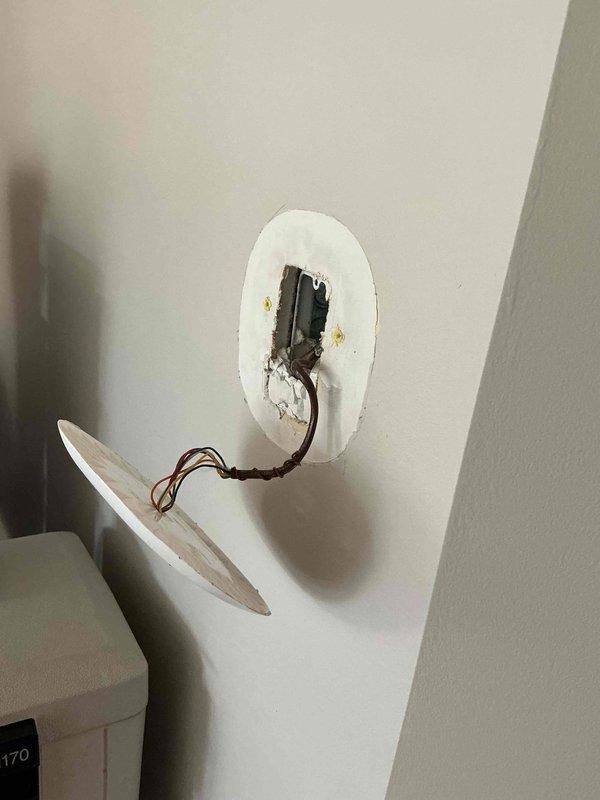 Responded to service call for Ecobee smart thermostat experiencing intermittent power loss. Upon inspection, discovered evidence of electrical arcing and heat damage at the thermostat wall mounting location, with visible scorching and discoloration around the junction box and loose wiring present. Diagnosed power supply issue caused by compromised electrical connections at the wall plate, likely resulting from inadequate wire termination or damaged wiring. Documented existing conditions with photos showing heat-damaged drywall and exposed wiring. Unit remains under manufacturer warranty coverage. Recommended replacement thermostat unit and proper electrical repair to ensure safe, reliable operation of the HVAC control system.