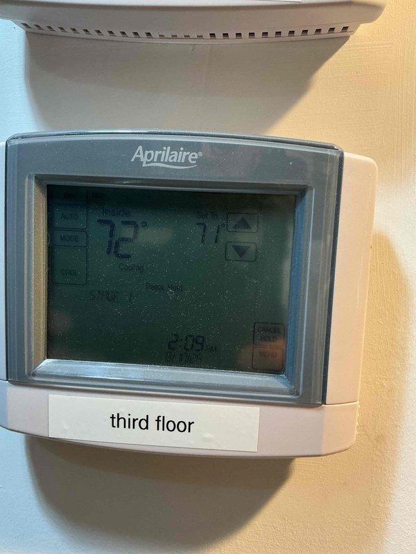 Responded to cooling complaint on second floor system unable to maintain setpoint of 70°F, with actual temperature remaining at 73°F. Inspected HVAC unit and thermostat operation, verified system performance under warranty from recent installation. Documented equipment conditions and thermostat readings showing 72°F display at time of service.
