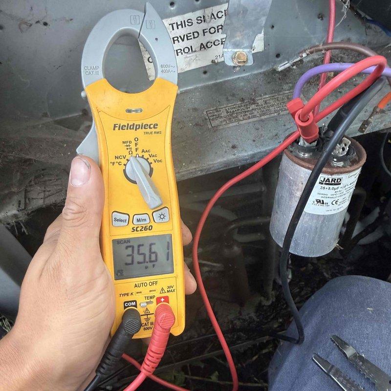 Responded to no cooling complaint with system unable to maintain setpoint of 75°F, actual temperature reading 78-79°F. Outdoor unit confirmed operational with condenser fan running. Upon inspection, discovered indoor air handler blower motor failure resulting in no airflow from supply registers. Measured amperage at 35.6A on system components during diagnostic testing. Verified thermostat properly calling for cooling and confirmed outdoor condensing unit responding appropriately. Identified failed blower motor as root cause preventing conditioned air distribution throughout living space while compressor and outdoor unit continued normal operation.