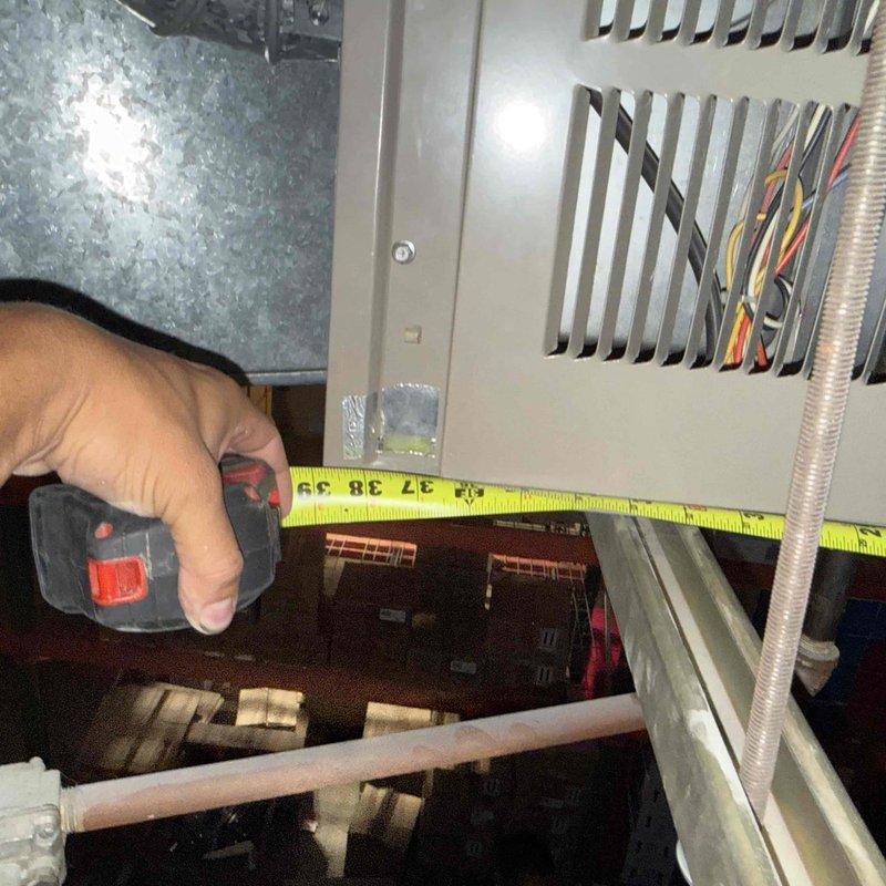 Responded to no-cooling complaint on commercial HVAC unit. Performed diagnostic inspection of air handling system, taking measurements of unit dimensions and clearances to assess accessibility and component spacing. Documented existing copper refrigerant line condition showing signs of age and oxidation. Contacted office to coordinate approval process with property management for recommended repairs before proceeding with additional work.