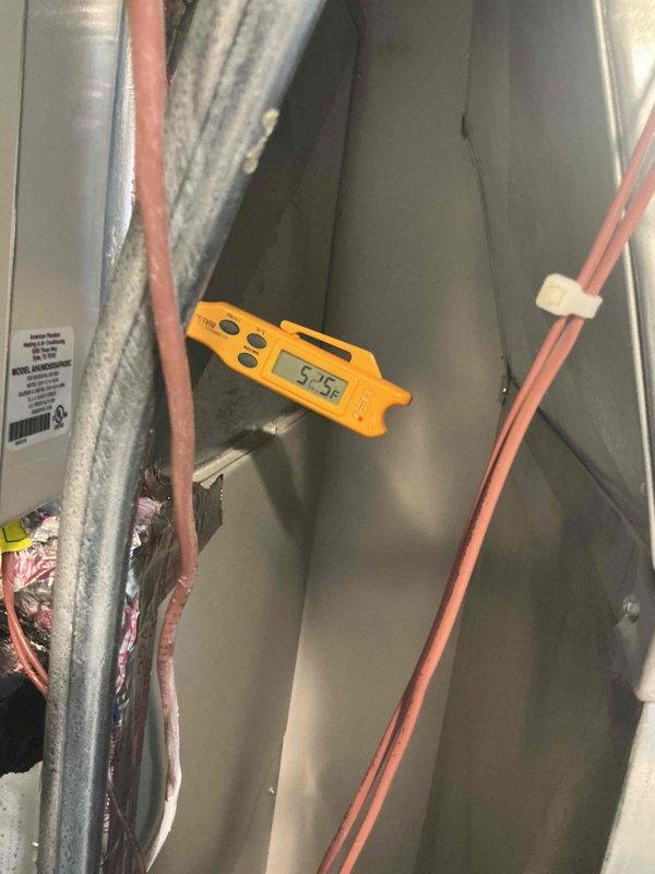 Completed warranty replacement of condenser fan motor on second floor Ruud AC unit. Documented coil conditions and unit identification with photographs per service protocol, including model/serial number verification and temperature readings showing 54.5°F at the evaporator coil, confirming proper system operation post-repair.