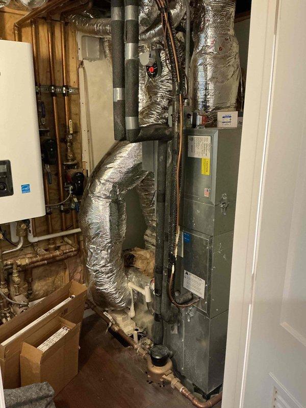 Completed wiring installation for fresh air damper at basement furnace unit, integrating connections with kitchen hood pressure switch to ensure proper ventilation interlock operation. Investigated and addressed rattling supply vent issue in third floor bedroom, inspecting ductwork runs and securing loose components in the HVAC distribution system. Verified all electrical connections at thermostat terminals and confirmed proper system operation upon completion.