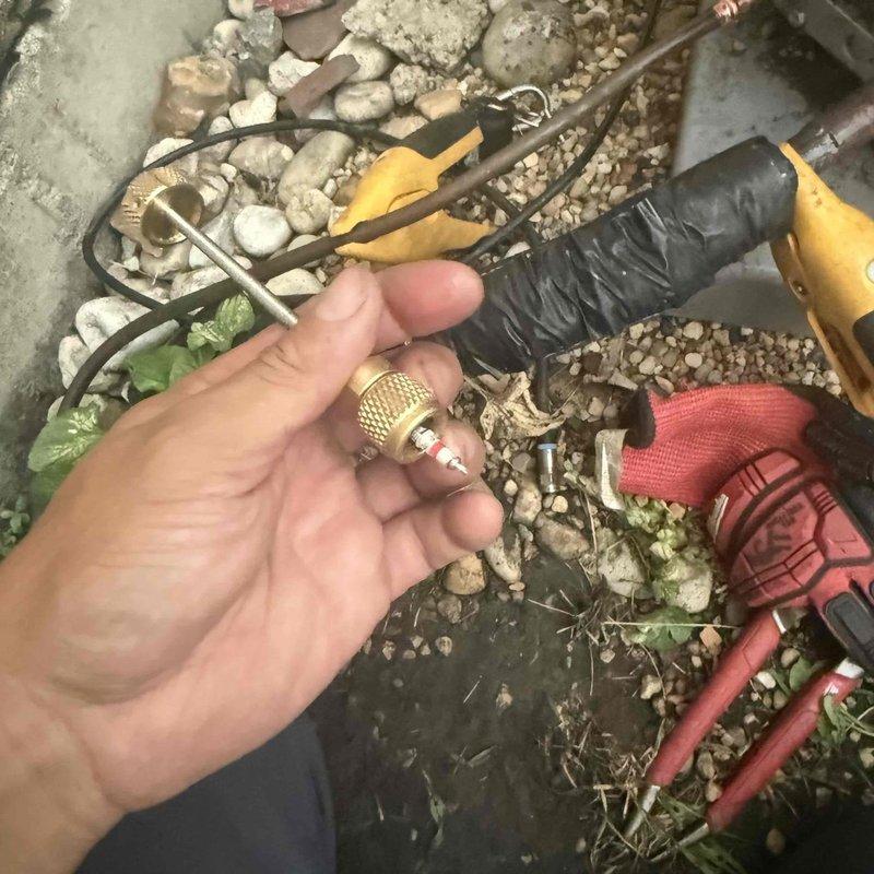 Responded to service call for system leak detection. Performed diagnostic evaluation of A/C system components and removed valve screen assembly from outdoor unit for inspection. Continued troubleshooting procedures to isolate source of refrigerant leak. System currently set to 70°F with ambient temperature at 73°F. Further leak detection work required to pinpoint exact location of system failure.