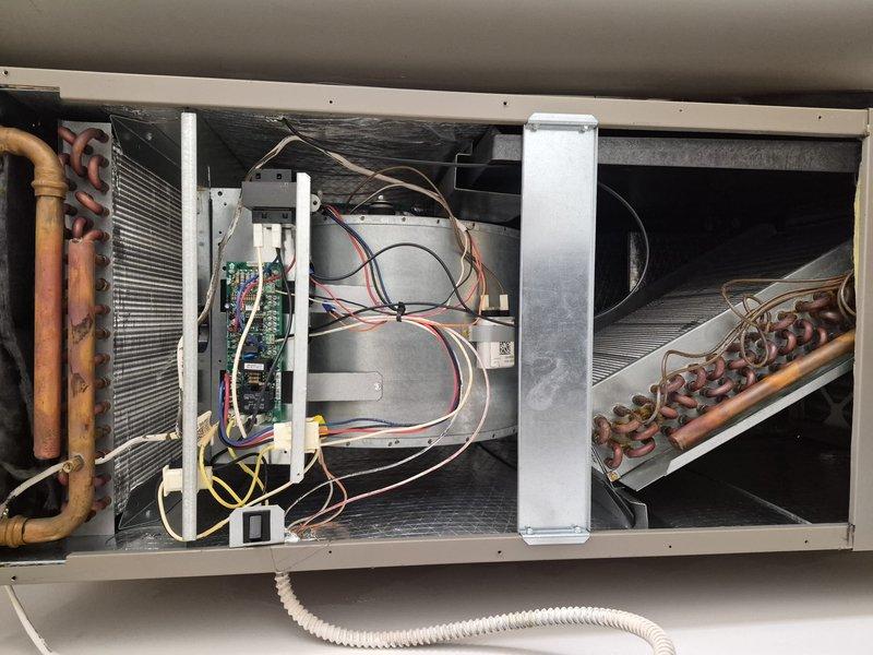 Responded to service call for air conditioning system that home inspector was unable to operate prior to property sale. Provided operational instruction on Honeywell Home ProSeries thermostat to family representative, demonstrating proper startup procedures and basic system controls. Performed visual inspection of indoor air handler unit, noting age-related copper line discoloration but confirmed system operational functionality.