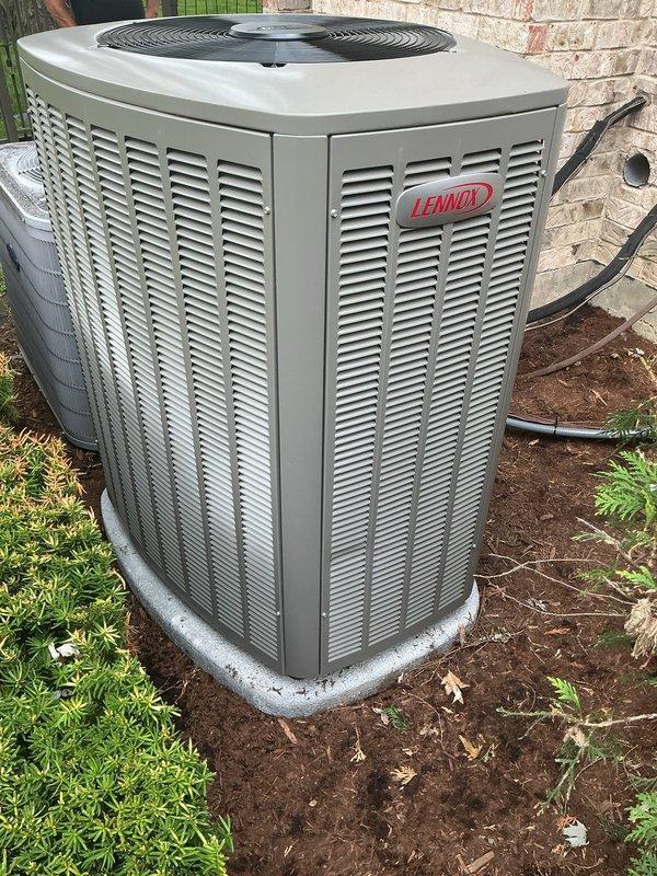 Completed full HVAC system replacement on first floor, including removal of existing equipment and installation of new Lennox air conditioning unit and furnace. Installed humidifier as part of the system upgrade. New outdoor condenser unit positioned on pad against exterior brick wall with proper refrigerant line routing and electrical connections completed. All equipment tested and verified operational upon completion.