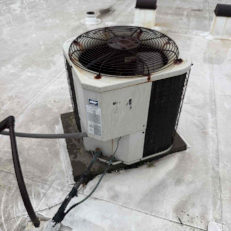 Responded to no-cooling call for commercial office air conditioning unit. Diagnosed failed run capacitor on rooftop condenser unit. Replaced defective capacitor with new component under CSA coverage, restoring system to normal operation.