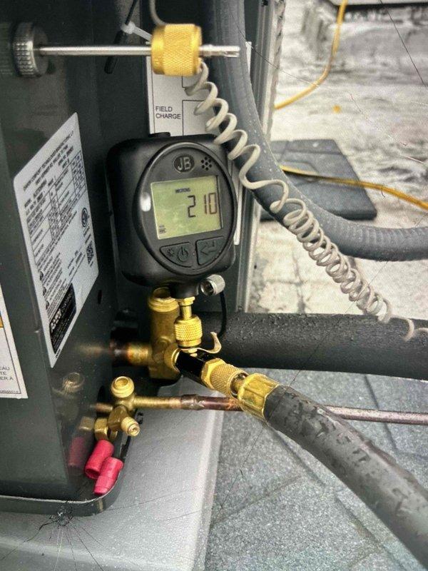 Responded to warranty call for AC leaking issue. Found water accumulation in safety pan beneath evaporator coil due to improper drain line pitch. Uninstalled and repositioned equipment to achieve proper drainage slope. Verified correct pitch by performing multiple water tests through coil and drain system before reinstalling furnace onto coil. System tested and operating properly with no further leakage detected.