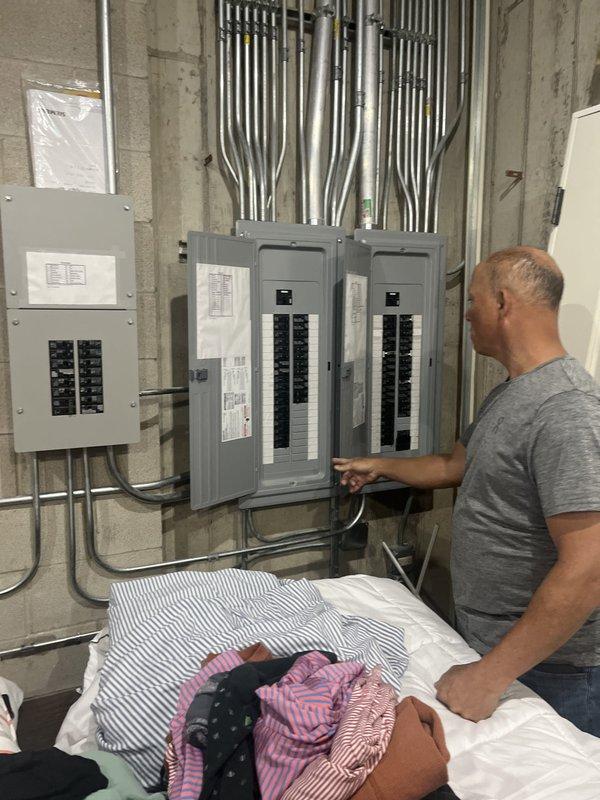 Responded to service call for first floor air conditioning system not cooling. Performed diagnostic evaluation of non-operational AC unit located on exterior patio. Inspected electrical panels in utility room to verify power supply and circuit breaker status. Assessed thermostat settings, air filter condition, and overall system operation. Evaluated communicating furnace and air conditioning system components. Documented equipment information and current system conditions. Provided estimate for complete HVAC system replacement based on diagnostic findings and equipment failure assessment.