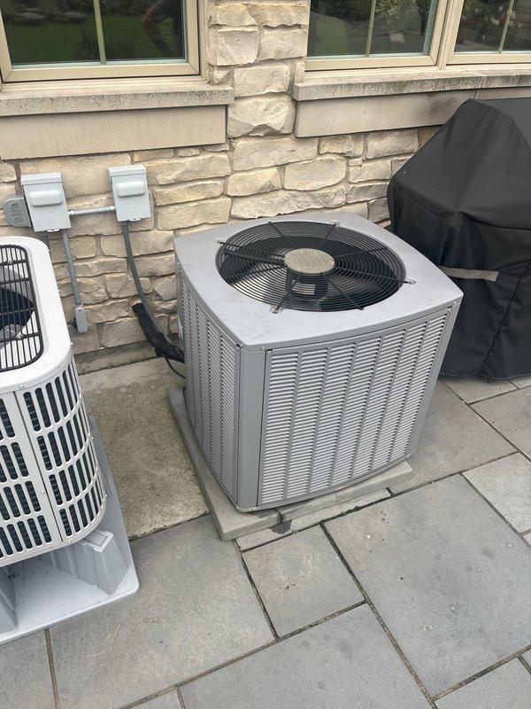 Responded to service call for first floor air conditioning system not cooling. Performed diagnostic evaluation of non-operational AC unit located on exterior patio. Inspected electrical panels in utility room to verify power supply and circuit breaker status. Assessed thermostat settings, air filter condition, and overall system operation. Evaluated communicating furnace and air conditioning system components. Documented equipment information and current system conditions. Provided estimate for complete HVAC system replacement based on diagnostic findings and equipment failure assessment.