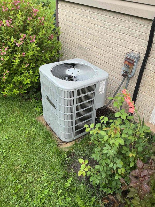 Completed Gold Clean and Check for Cooling maintenance on residential air conditioning system. Performed comprehensive inspection of outdoor condensing unit, including visual assessment of cabinet condition, coil cleanliness, and surrounding clearances. Verified proper electrical connections at disconnect box and measured system amperage using clamp meter, recording 388.2 amps during operation. Inspected condenser coil fins for damage and debris, confirmed adequate airflow through unit, and checked refrigerant line insulation. Unit operating within normal parameters with no deficiencies noted. All components functioning properly upon completion of preventive maintenance service.