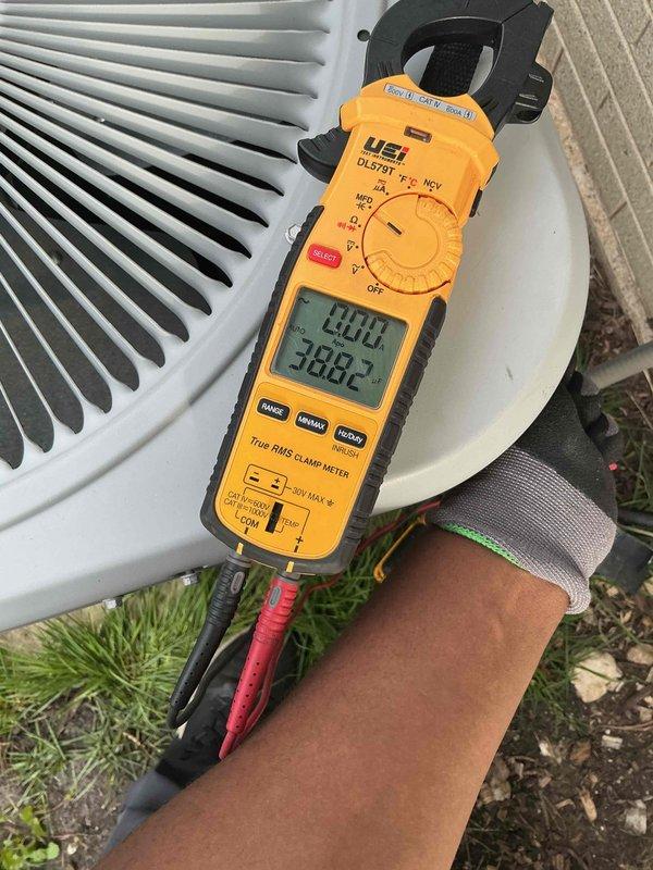 Completed Gold Clean and Check for Cooling maintenance on residential air conditioning system. Performed comprehensive inspection of outdoor condensing unit, including visual assessment of cabinet condition, coil cleanliness, and surrounding clearances. Verified proper electrical connections at disconnect box and measured system amperage using clamp meter, recording 388.2 amps during operation. Inspected condenser coil fins for damage and debris, confirmed adequate airflow through unit, and checked refrigerant line insulation. Unit operating within normal parameters with no deficiencies noted. All components functioning properly upon completion of preventive maintenance service.