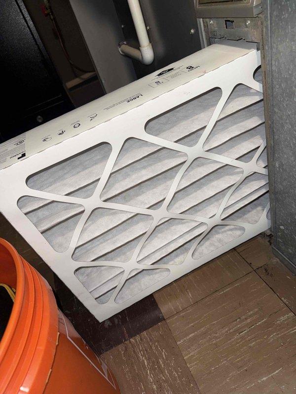 Responded to no-cooling complaint on residential air conditioning system. Performed diagnostic evaluation of outdoor unit, measuring electrical amperage at compressor circuit which registered 0.0A indicating failure to start. Inspected air filters in mechanical room and documented equipment information for new customer account setup.