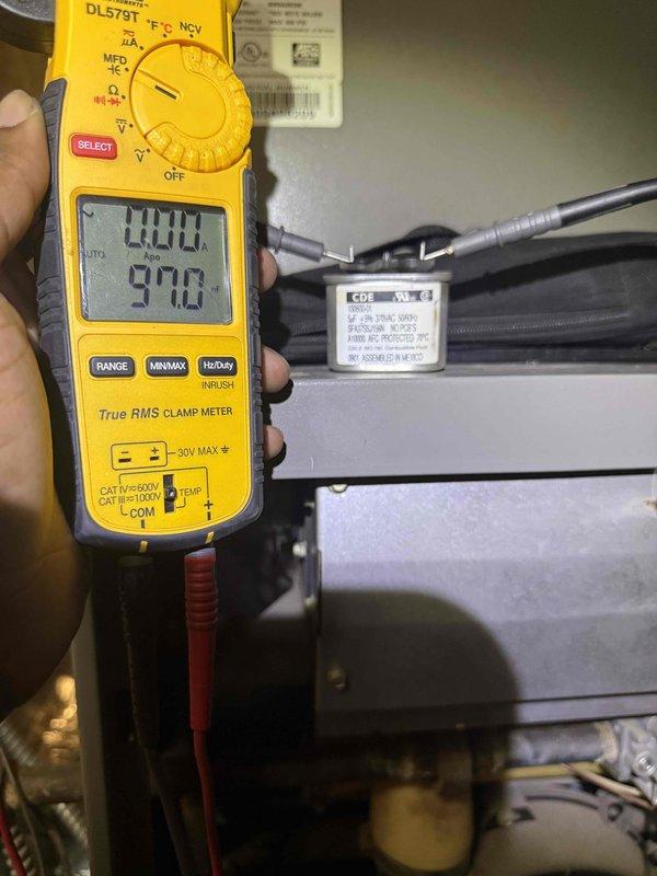 Responded to no-cooling complaint on residential air conditioning system. Performed diagnostic evaluation of outdoor unit, measuring electrical amperage at compressor circuit which registered 0.0A indicating failure to start. Inspected air filters in mechanical room and documented equipment information for new customer account setup.
