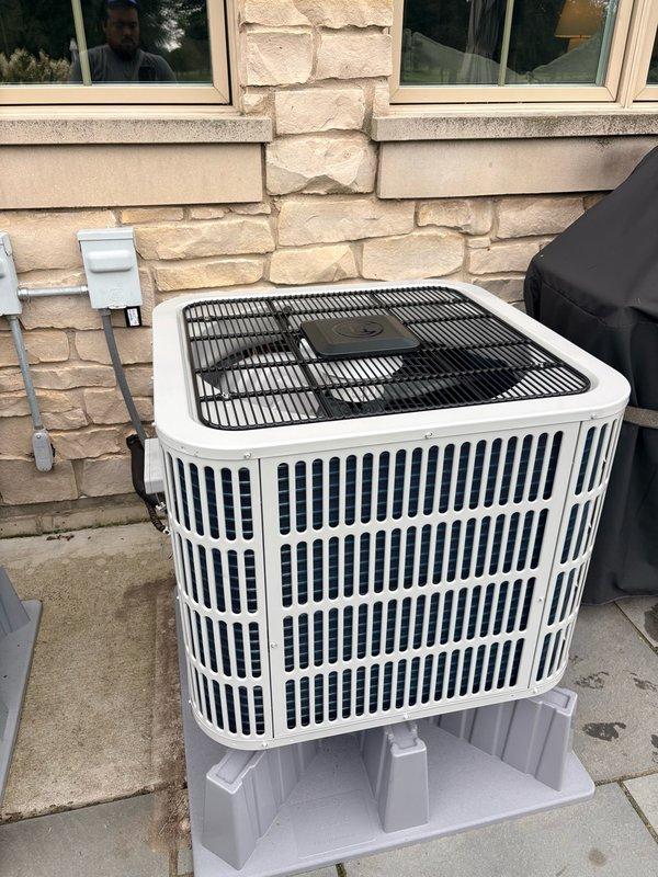 Completed return trip to finalize residential air conditioning installation. Successfully installed Bosch outdoor condensing unit on elevated plastic mounting platform against exterior wall with proper electrical connections and junction box. Verified all interior components, wiring connections, and system integration with existing ductwork.