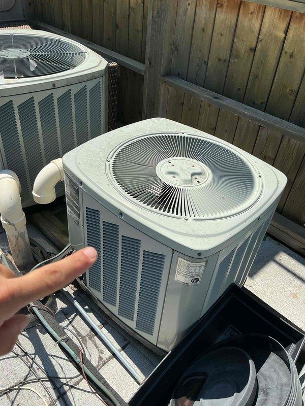 Responded to service call for air conditioning system not cooling properly. Performed diagnostic evaluation of multiple rooftop condenser units to identify source of cooling failure. Inspected refrigerant lines, electrical connections, and compressor operation across the installation. Documented equipment information and current system configuration with photo records for service history.