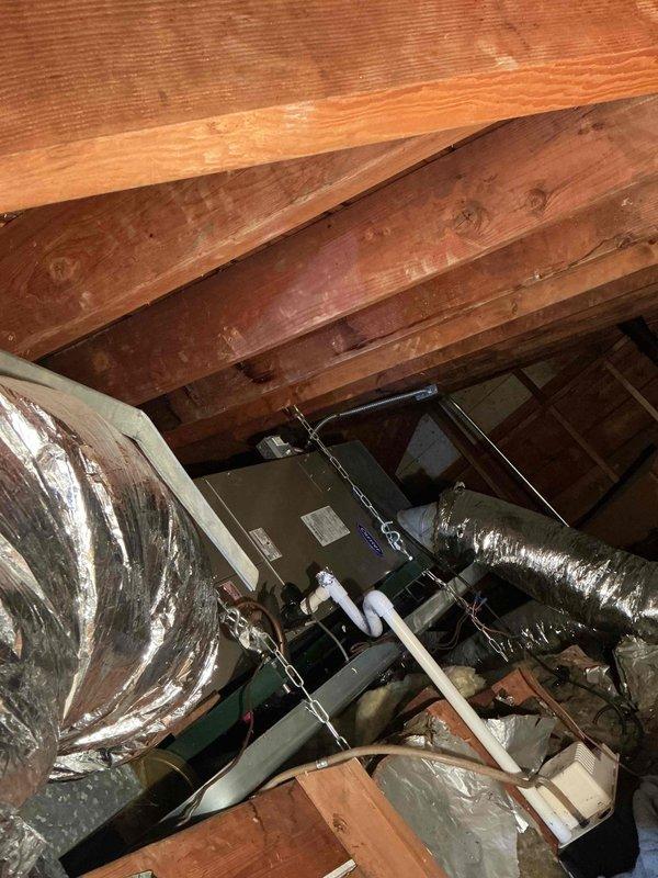 Responded to service call for 11-year-old Carrier AC system not activating when thermostat called for cooling. Upon arrival, confirmed air handler in attic was operational and receiving power, but outdoor condensing unit failed to energize. Verified electrical panel breaker was functioning properly. Traced low-voltage control circuit from thermostat through air handler to outdoor unit. Diagnosed failed contactor in outdoor condensing unit preventing compressor and condenser fan operation. Replaced defective contactor, tested system operation through complete cooling cycle, and verified proper amperage draw on compressor and fan motor. System restored to normal operation with outdoor unit now responding correctly to thermostat calls.