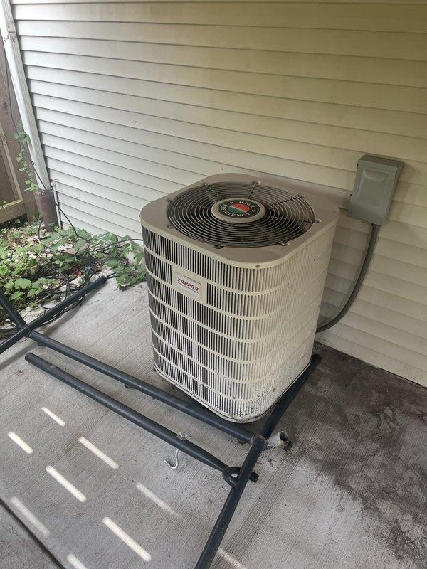 Conducted HVAC system evaluation for replacement estimate on aging 22-year-old air conditioning unit and 14-year-old furnace system. Assessed existing outdoor condenser unit positioned on concrete pad with elevated platform mounting, noting system age and operational status. Discussed heat pump conversion options with communicating furnace integration to optimize existing solar power installation. Performed Gold Clean & Check cooling service protocol, including comprehensive system inspection and documentation. Measured attic space clearances and evaluated existing ductwork configuration to determine compatibility requirements for proposed heat pump and communicating furnace installation. Documented equipment specifications, mounting locations, and structural considerations through photographic records of outdoor condenser unit and attic access points for future replacement planning.