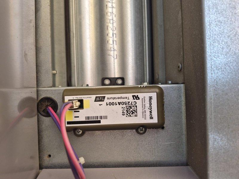 Responded to no cooling complaint in commercial building hallway. Inspected HVAC system and identified issue with Honeywell GT250A1001 control module. Evaluated thermostat operation, verified system settings, and documented control panel wiring configuration for diagnostic purposes.