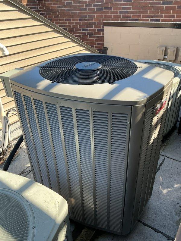 Completed full air conditioning system replacement including reclamation of existing refrigerant from old condenser, coil, and line-set, followed by removal and disposal of aged equipment. Installed new Lennox 3-ton 18 SEER2 variable speed condensing unit (Model EL18KCV-036-230) on roof along with new evaporator coil, connected to existing copper refrigerant lines. System was evacuated to remove moisture and air, then charged with R454B refrigerant per manufacturer specifications. Installed Refrigerant Detection System (RDS) for enhanced safety monitoring. Additionally, drained water heater below T&P valve to perform copper pipe repair on hot water side, then refilled and tested system. All equipment was started up, tested, adjusted for optimal performance, and passed complete safety inspection with 10-year parts warranty and 10-year extended labor agreement on HVAC system.