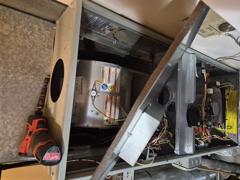 Responded to service call for air conditioning unit producing excessive noise. Upon arrival, accessed the HVAC system through the mechanical compartment and performed diagnostic inspection of the air handler assembly, blower motor, and associated components. Utilized clamp meter to measure electrical current draw and verify proper amperage levels on the system. Inspected all mechanical connections, ductwork mounting, and verified secure installation of components to identify source of unusual operational noise.