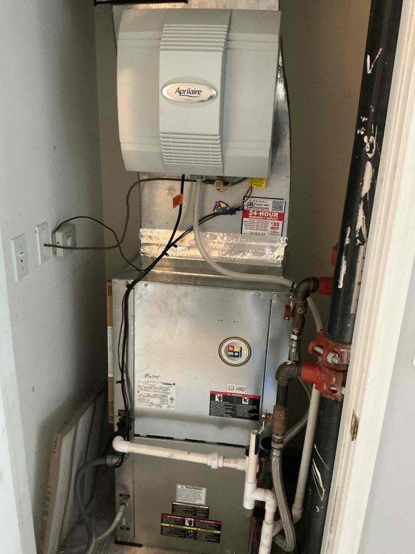 Performed preventive maintenance on two heat pump systems. Inspected indoor air handler equipment including furnace components, Aprilaire humidifier, electrical connections, and associated gas lines with shutoff valves. Verified Honeywell Home ProSeries thermostat operation and system controls. All equipment photographed and documented for service records.