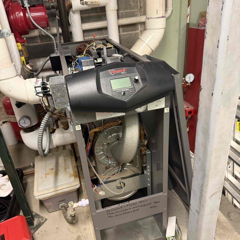 Completed comprehensive fall preventative maintenance per commercial agreement at multi-system facility. Performed clean and check procedures on commercial boiler system, inspecting burner assembly, heat exchanger, controls, and venting components while verifying proper combustion readings of 62.9°F flue temperature. Conducted clean and check service on water heater, examining all operational components and safety devices. Completed clean and check maintenance on sixteen rooftop units, including filter replacements and full system inspections to ensure proper operation of all HVAC equipment entering heating season.