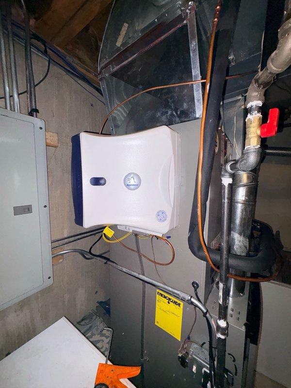 Returned to site to address ongoing air leakage concerns on recently installed Lennox HVAC system. Conducted thorough inspection of furnace, air handler, and ductwork connections in basement mechanical room and attic space. Documented current installation condition with photos showing wall-mounted equipment, furnace unit with ductwork connections, copper piping, and attic-mounted HVAC components with ENERGY STAR certification. Discussed installation concerns with family member present who has industry experience with Lennox products. Customer remains concerned about air leakage issues and overall installation quality requiring further evaluation and remediation.