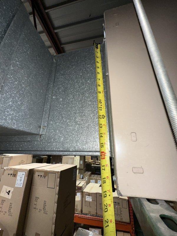 Completed comprehensive site assessment and measurements for commercial HVAC full system replacement. Documented existing ductwork dimensions and clearances in mechanical area, measuring vertical clearances ranging from 8 to 26 inches along galvanized metal ductwork and structural components. Evaluated installation space constraints including proximity to industrial shelving, exposed ceiling structure with corrugated metal decking, and existing flexible ductwork routing to ensure proper equipment fitment and code compliance for new system installation.