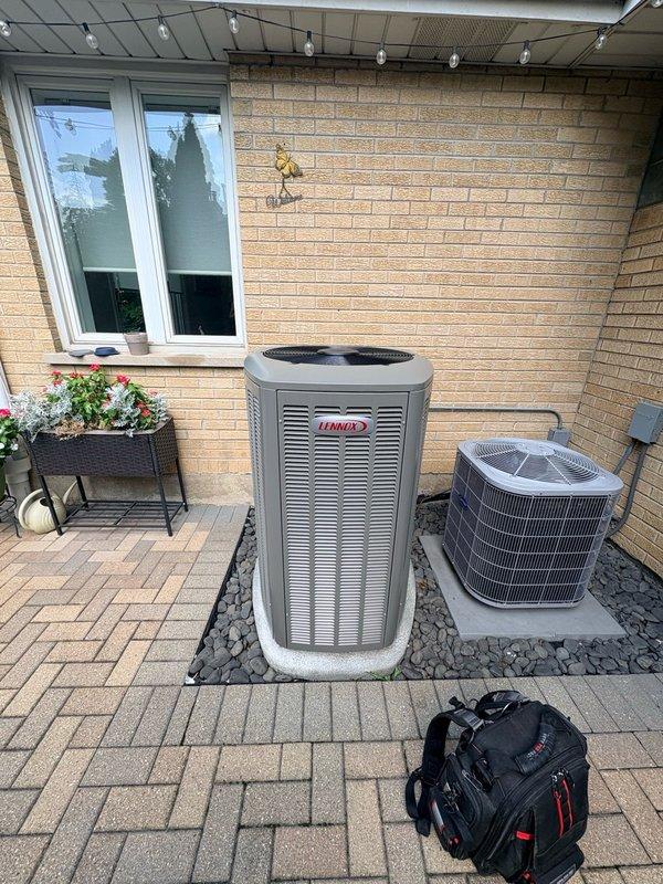 Responded to warranty service call for noise complaint on recently installed Lennox air conditioning system. Performed comprehensive inspection of outdoor condenser unit and indoor ventilation components. Verified proper installation of multi-unit HVAC system including mounting, electrical connections, and refrigerant lines. Inspected all grilles and ductwork for proper airflow and secure installation. Documented system condition with photographs showing equipment placement on paver stone pad with proper clearances maintained. All components found to be operating within manufacturer specifications with no defects related to installation workmanship identified.