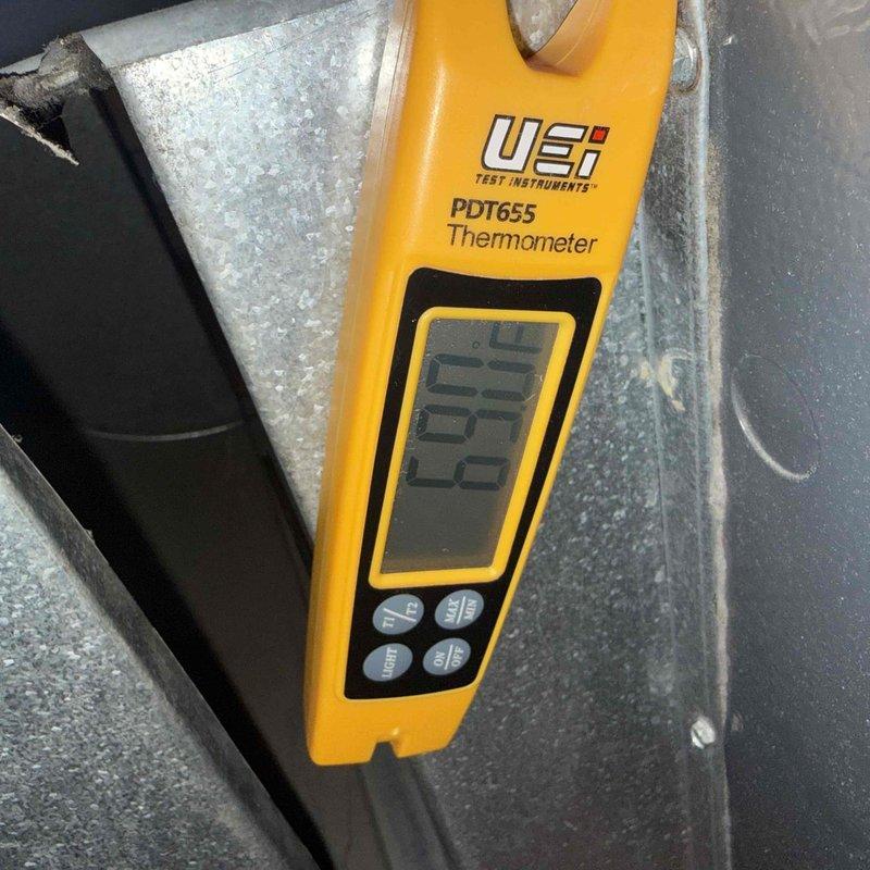 Performed annual clean and check maintenance on air conditioning system at rectory location per comfort plan agreement. Inspected and photographed blower wheel assembly, noting moderate dust accumulation on squirrel cage blades and housing. Verified temperature readings using calibrated digital thermometer and documented equipment information for service records.
