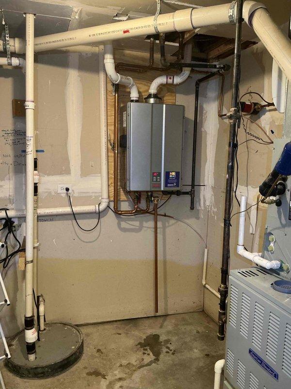 Performed comprehensive maintenance and inspection on wall-mounted tankless water heater system. Verified operation of all internal components including heat exchanger, burner assembly, and electronic control board with digital display. Confirmed proper function of brass isolation valves, water flow sensors, and exhaust venting system with PVC piping. Unit operating within manufacturer specifications with all safety controls responding appropriately.