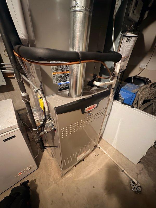 Completed warranty service on residential furnace by replacing broken door connectors. Retrieved replacement parts from office and installed new connectors to ensure proper door function and secure cabinet closure. Documented completed repair with photos.