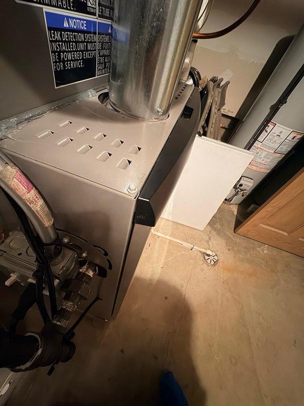 Completed warranty service on residential furnace by replacing broken door connectors. Retrieved replacement parts from office and installed new connectors to ensure proper door function and secure cabinet closure. Documented completed repair with photos.
