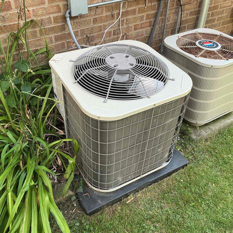 Completed comprehensive tune-up and inspection on two outdoor air conditioning condenser units serving a multi-floor property. Performed standard maintenance procedures on both systems including visual inspection of external components, electrical connections, and refrigerant line sets. Inspected and documented condition of capacitors and contactors in both units, verifying proper electrical connections and wire integrity. All components found to be in functional operating condition with units properly mounted on concrete pad with appropriate vibration isolation. Both systems operational upon completion of service visit.