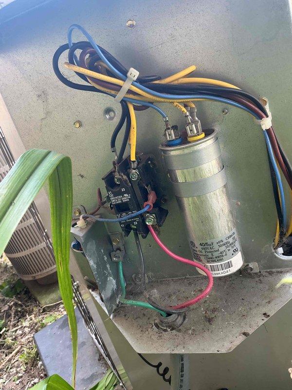 Completed comprehensive tune-up and inspection on two outdoor air conditioning condenser units serving a multi-floor property. Performed standard maintenance procedures on both systems including visual inspection of external components, electrical connections, and refrigerant line sets. Inspected and documented condition of capacitors and contactors in both units, verifying proper electrical connections and wire integrity. All components found to be in functional operating condition with units properly mounted on concrete pad with appropriate vibration isolation. Both systems operational upon completion of service visit.