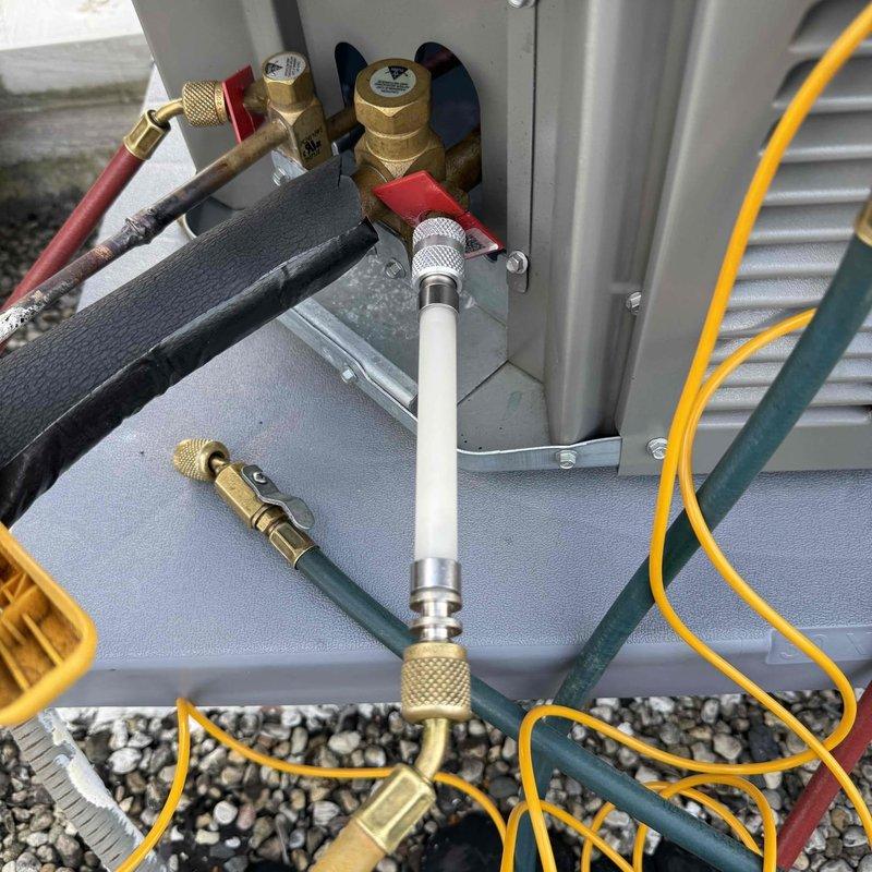 Responded to warranty service call for HVAC system with continuous fan operation and insufficient cooling. Upon inspection, verified thermostat settings, checked air filter condition, and confirmed electrical breakers were functioning properly. Performed diagnostic temperature readings at the air handler, recording 75°F at the unit. Connected manifold gauges to the outdoor condensing unit's service ports to measure refrigerant pressures and assess system performance. Evaluated refrigerant lines and electrical connections at the outdoor unit during testing procedures to diagnose the no-cool condition and determine appropriate corrective action under warranty coverage.