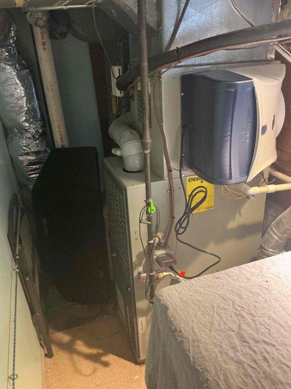 Performed comprehensive air conditioning service call following humidifier replacement to address suspected system issues. Conducted thorough diagnostic inspection of HVAC system including air handler unit, ductwork connections, and associated mechanical components in basement installation. Evaluated system operation, verified proper airflow through flexible ductwork and metal supply ducts, and assessed overall equipment condition. Documented all equipment information and photographed installation for service records. Discussed available comfort plan options and new customer discount opportunities with homeowner.