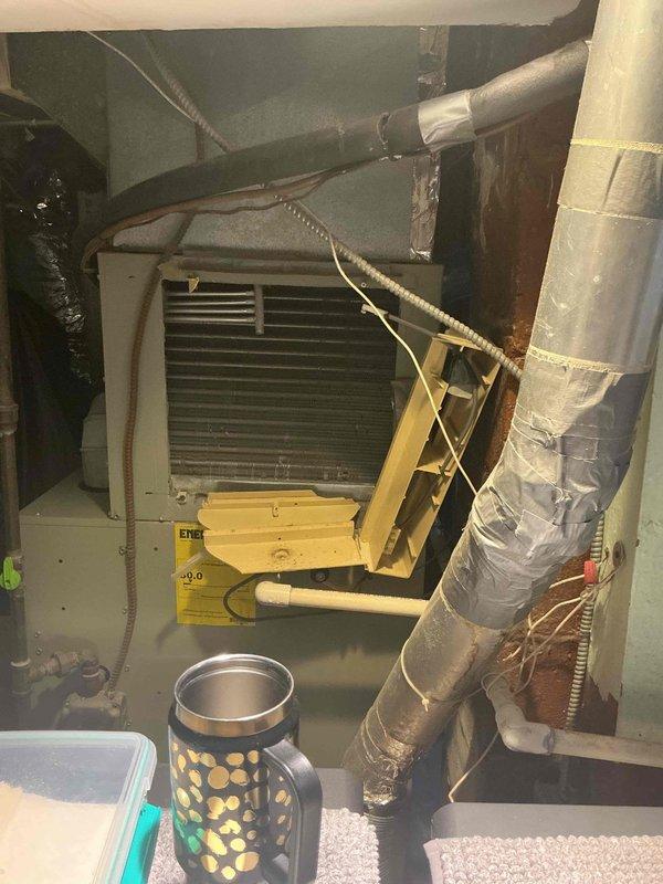 Performed comprehensive air conditioning service call following humidifier replacement to address suspected system issues. Conducted thorough diagnostic inspection of HVAC system including air handler unit, ductwork connections, and associated mechanical components in basement installation. Evaluated system operation, verified proper airflow through flexible ductwork and metal supply ducts, and assessed overall equipment condition. Documented all equipment information and photographed installation for service records. Discussed available comfort plan options and new customer discount opportunities with homeowner.