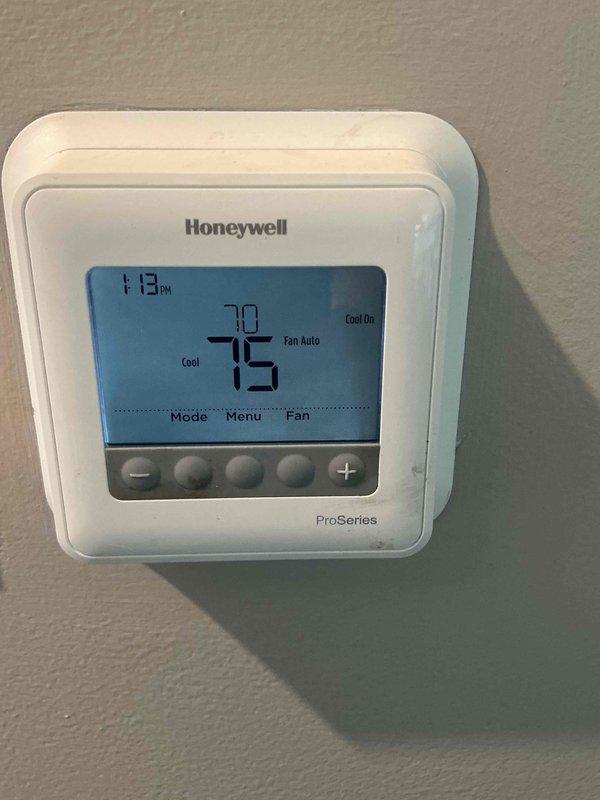 Completed comprehensive clean and check maintenance on heat pump system per Comfort Plan agreement. Performed full inspection of indoor air handler unit located in utility closet, including filter evaluation, electrical connections check, and verification of proper blower operation. Inspected refrigerant lines, PVC condensate drainage system, and service valves for proper operation and signs of wear. Verified thermostat programming and operation, confirming system responding correctly to cooling calls with fan set to auto mode and maintaining proper temperature control at 70°F current with 75°F setpoint. All system components found operating within normal parameters with no immediate service needs identified.