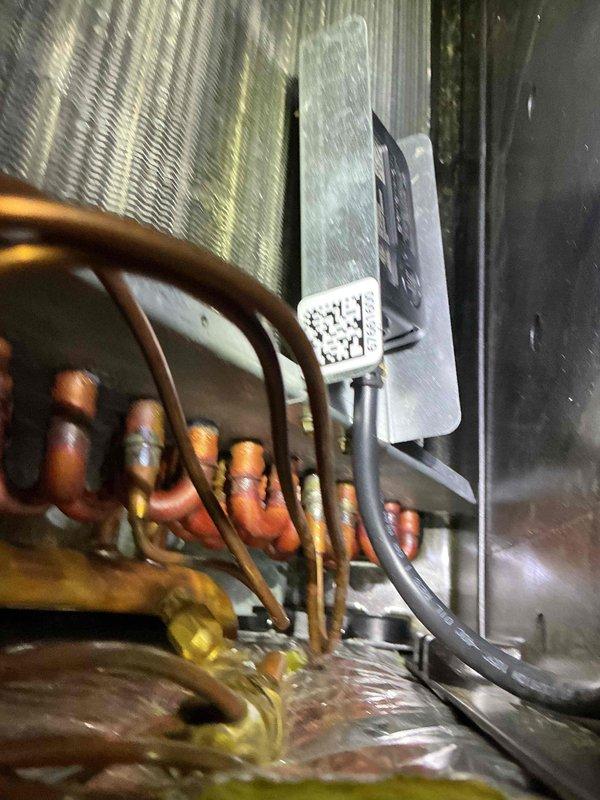 Returned to residential property under warranty to perform leak search on HVAC system following previous refrigerant top-off with EasySeal. Utilized UV light detection and bubble solution methods to locate refrigerant leak in air handler unit. Inspected evaporator coil assembly, copper line connections, and service valves for leak indicators.