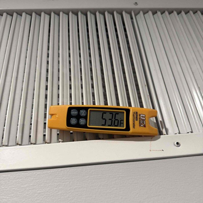 Responded to follow-up no cooling complaint on commercial HVAC unit. Previous technician had addressed clogged filters, but cooling issue persisted. Upon arrival, verified thermostat settings at 71°F while ambient temperature measured 77.1°F, confirming inadequate cooling performance. Measured supply air temperature at return grille registering 53.6°F. Documented thermostat configuration with lockbox protection and existing probe notation. Coordinated with office regarding continuation of diagnostic work and approval process for additional service time required to complete troubleshooting and repairs.