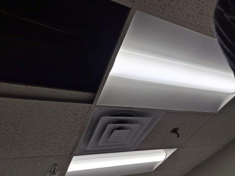 Completed warranty install inspection and documentation for HVAC system. Installed ceiling supply diffuser in commercial drop ceiling grid with proper alignment to existing acoustic tile layout and lighting fixtures. Observed evaporator coil assembly with excessive frost buildup during inspection, indicating potential airflow restriction or refrigerant charge issue requiring follow-up coordination with supervisor regarding insulation placement per warranty specifications.