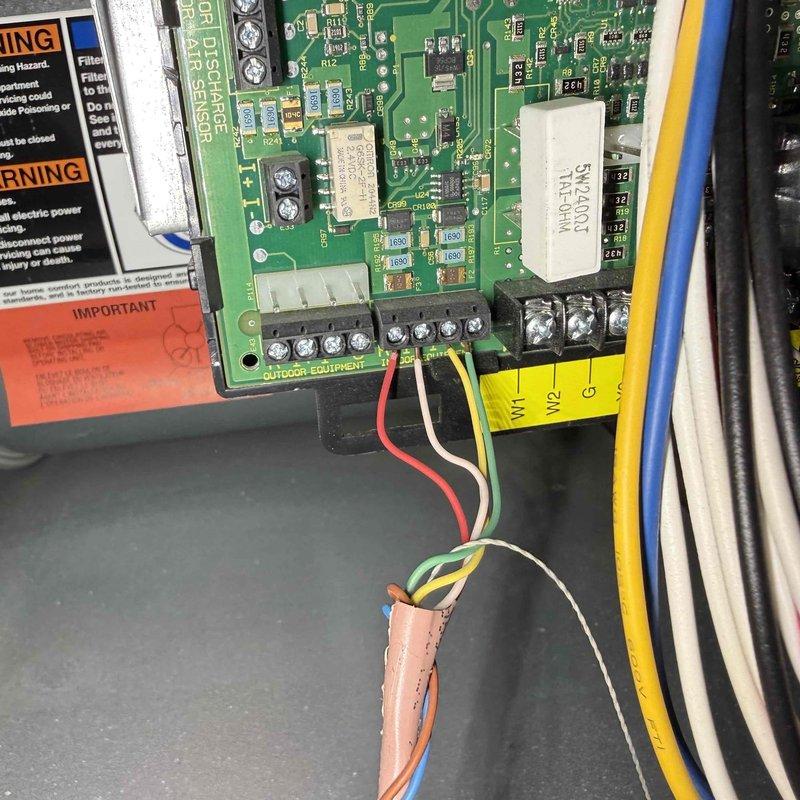 Responded to no cooling complaint on second floor unit. Upon arrival, confirmed system was not operating despite customer attempting to reset breaker. Performed diagnostic inspection of Bryant outdoor unit and examined control board assembly. Inspected circuit board components including relays, capacitors, and terminal connections. Verified wiring integrity at terminal block connections for compressor, fan, and control circuits. Documented equipment information and control board configuration with photos for service records.