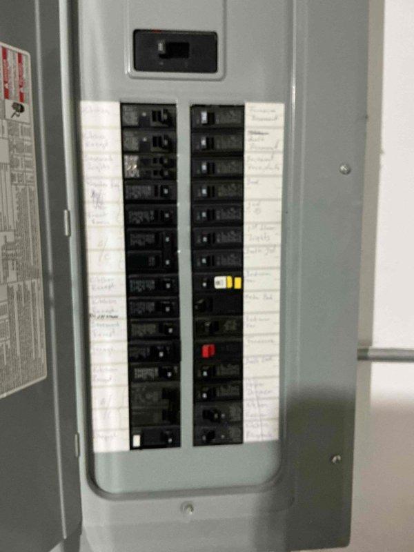 Responded to no-cooling complaint on second floor system. Upon arrival, performed diagnostic evaluation of 19-year-old air conditioning unit. Inspected electrical components and verified proper power supply at breaker panel. Documented electrical panel configuration and circuit breaker arrangement for system reference. Evaluated overall system condition and discussed equipment age considerations with homeowner. Provided assessment of repair versus replacement options given the age of the unit and recent service history. Photographed electrical distribution panel for service records.