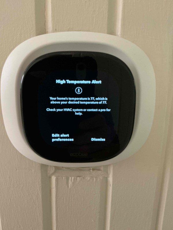 Responded to service call for thermostat displaying inaccurate temperature readings following a power outage. Upon arrival, found ecobee smart thermostat showing temperature discrepancy of approximately 4 degrees between displayed reading and actual indoor temperature, with unit also generating high temperature alerts. Performed system diagnostics and recalibrated thermostat temperature sensor to restore accurate temperature detection and display functionality, resolving the post-outage malfunction and ensuring proper system operation.