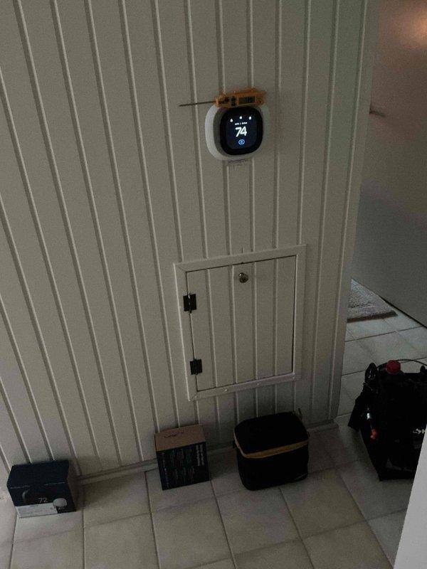 Responded to service call for thermostat displaying inaccurate temperature readings following a power outage. Upon arrival, found ecobee smart thermostat showing temperature discrepancy of approximately 4 degrees between displayed reading and actual indoor temperature, with unit also generating high temperature alerts. Performed system diagnostics and recalibrated thermostat temperature sensor to restore accurate temperature detection and display functionality, resolving the post-outage malfunction and ensuring proper system operation.