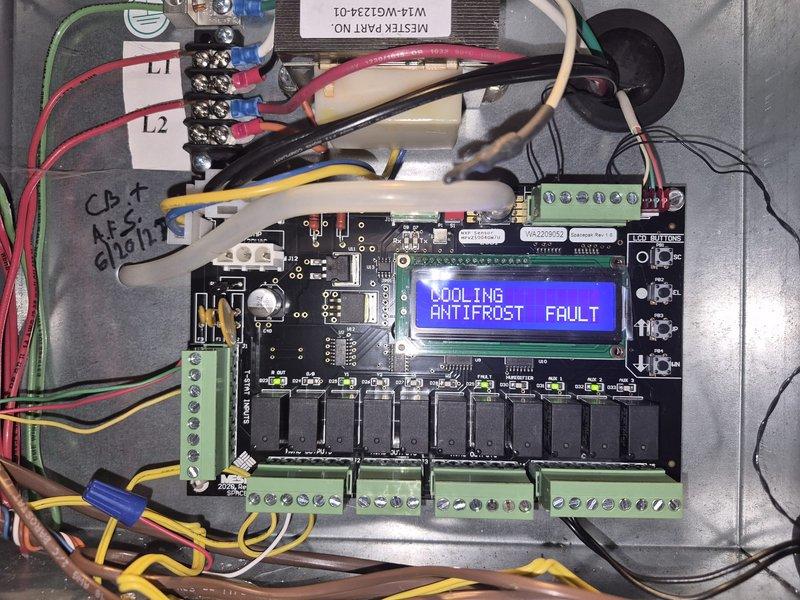 Responded to no cooling complaint on five-year-old SpacePak SDHV system located in attic. Upon arrival, found unit displaying "COOLING ANTIFROST FAULT" on control board LCD screen. Diagnosed anti-freeze protection safety lockout triggered by low refrigerant charge or restricted airflow condition. Inspected control board connections, relay operation, and wiring terminations. Documented fault condition with photographs of control panel and display. Cleared fault code and monitored system operation. Verified proper power supply to L1 and L2 terminals and confirmed all relay switches functioning correctly. System requires further evaluation of refrigerant charge levels and airflow measurements to determine root cause of anti-frost protection activation and restore full cooling capacity.