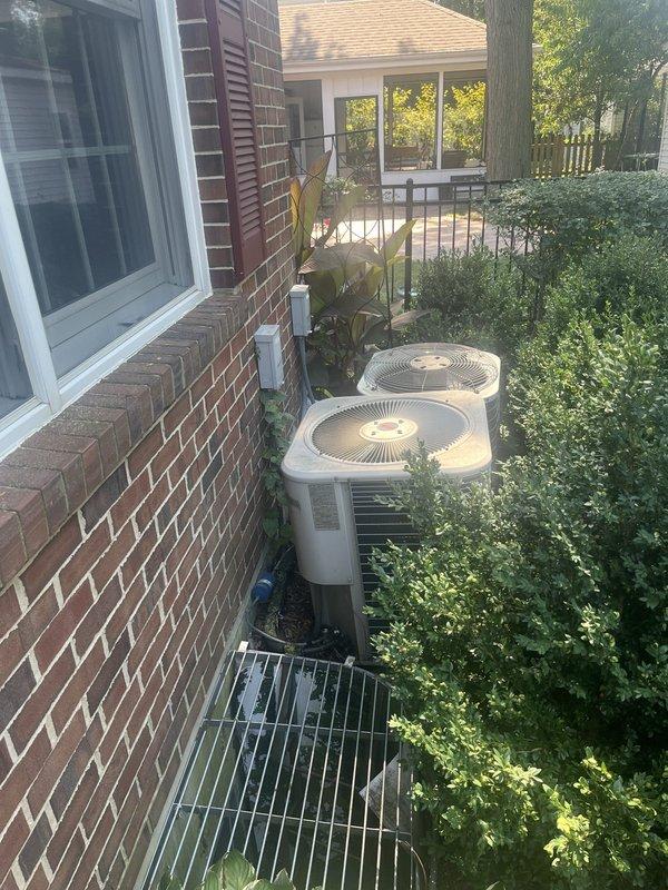 Conducted comprehensive assessment of two non-operational HVAC systems at residential property. Both air conditioning condenser units and corresponding furnace systems were evaluated for replacement due to complete system failure. Documented existing equipment configuration consisting of dual AC condensers positioned on concrete pad along exterior brick wall with associated indoor air handling components. Provided detailed replacement estimate covering removal of failed equipment and installation of new matched heating and cooling systems for both zones to restore climate control functionality to the residence.